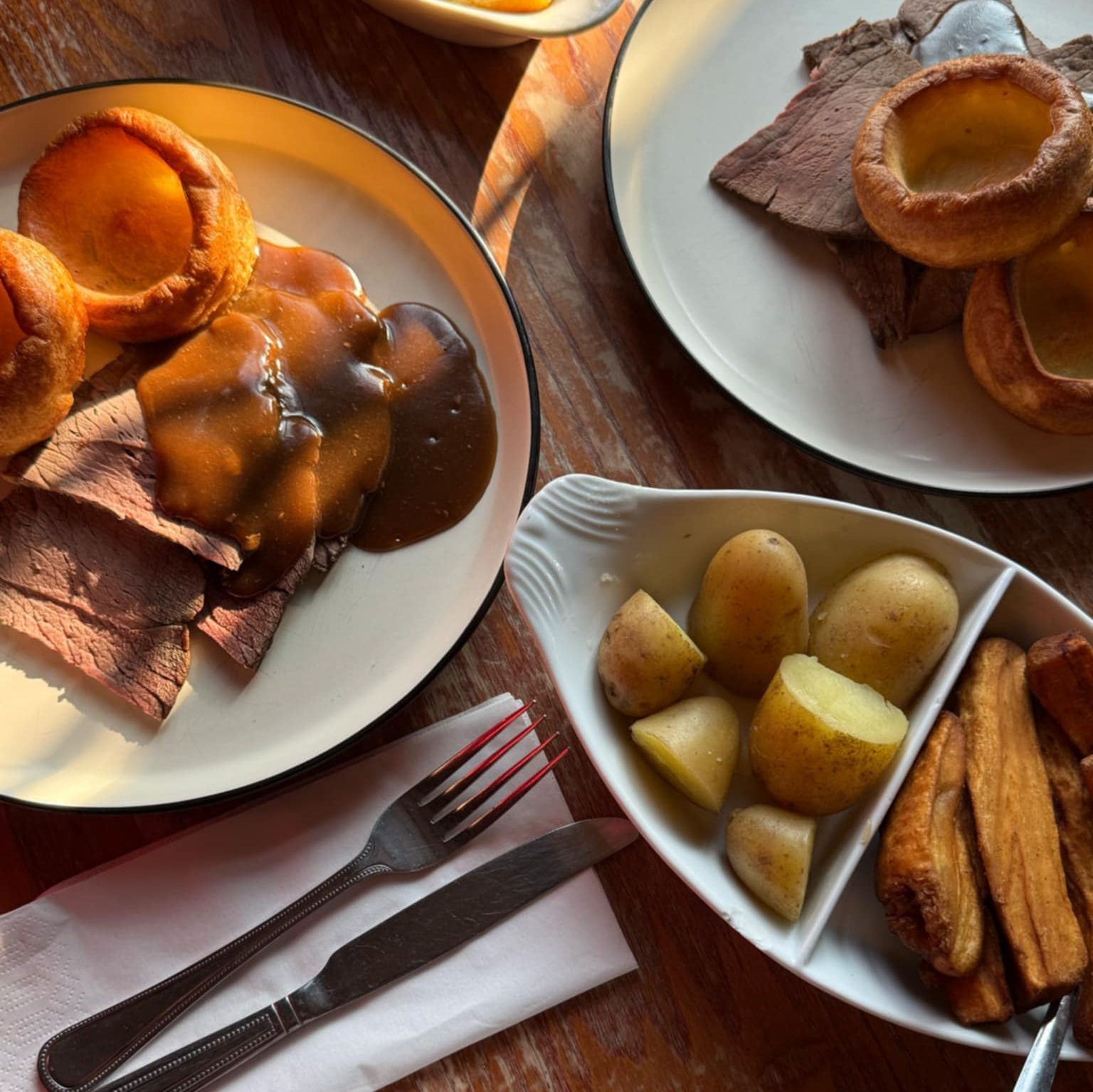 Sunday roast at The Dukes Head pub in Hamstreet, Kent, served with roast potatoes, vegetables, and Yorkshire pudding